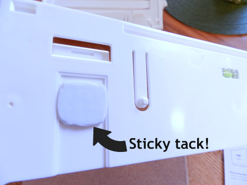 Sticky tack on wall manager