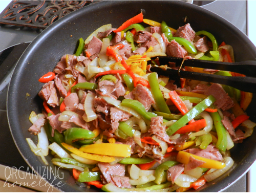 Cooked peppers, onions, and roast beef