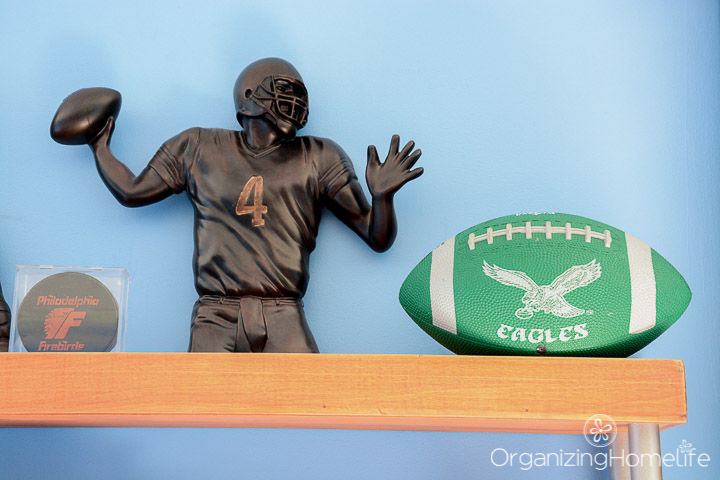 football figurine on boys shelf