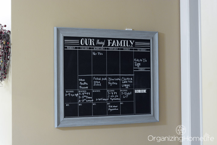 Organized schedules on a chalkboard in the kitchen